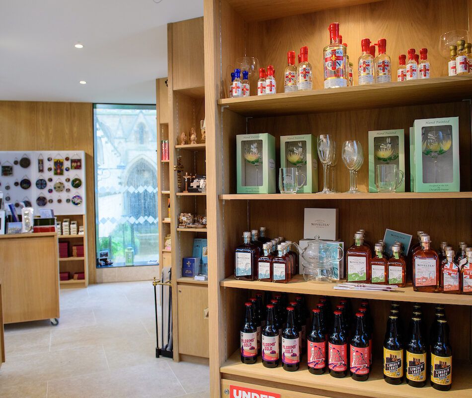inside lincoln cathedral shop with fully stocked shelves